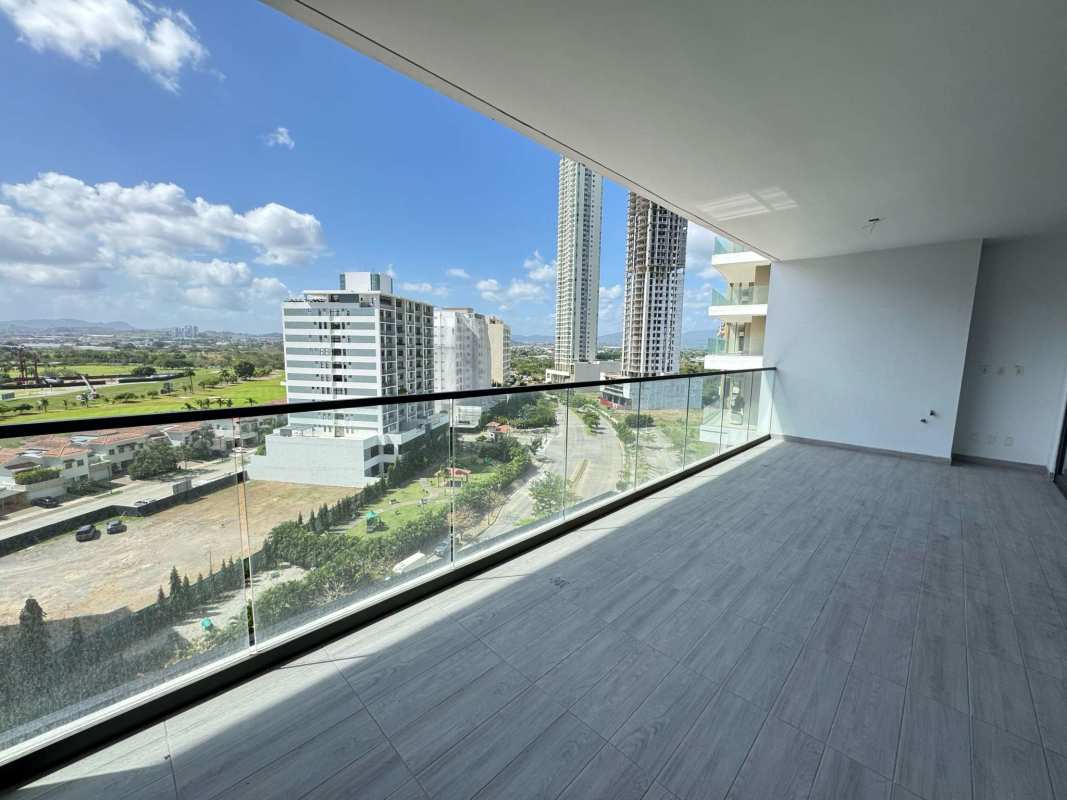 Spacious balcony with glass railing panoramic city golf view Empire Residences Santa María Panama