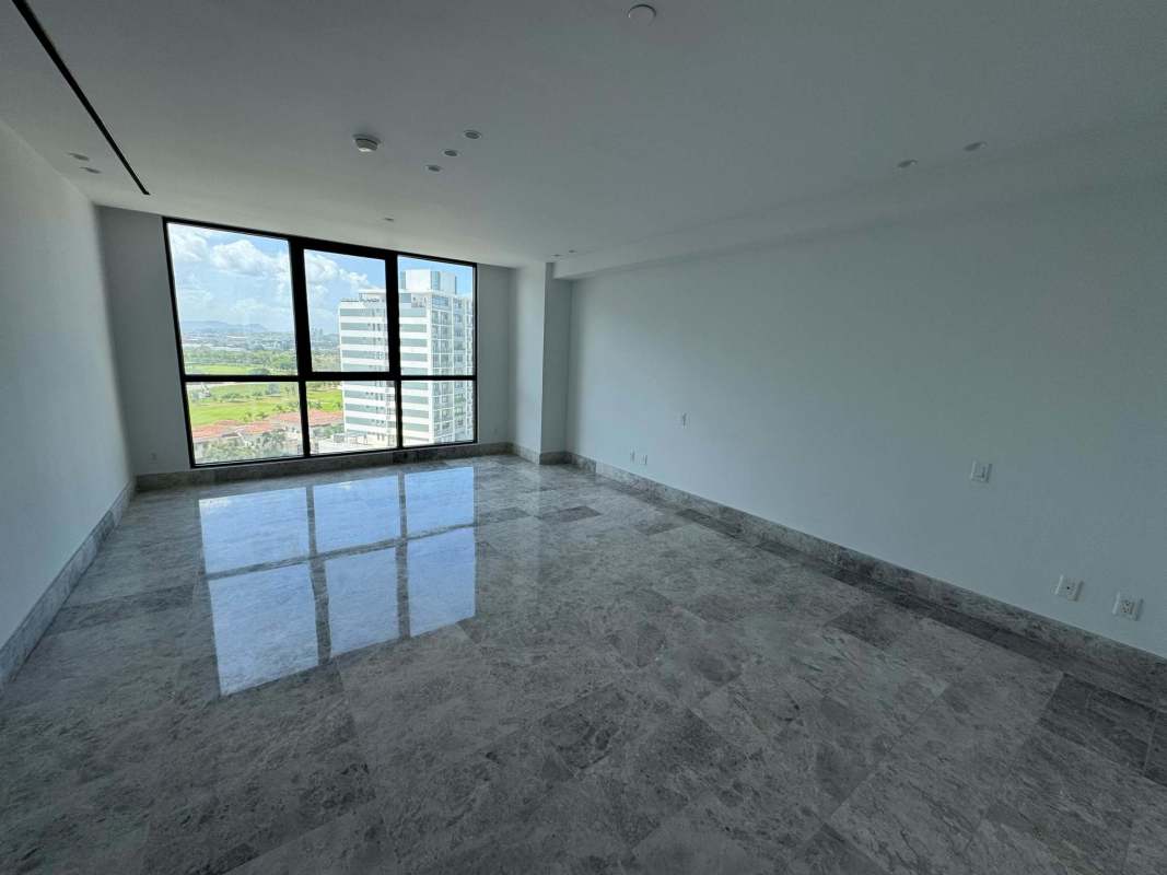 Minimalist living room with marble flooring and large window offering city view at Empire Residences Santa María Panama