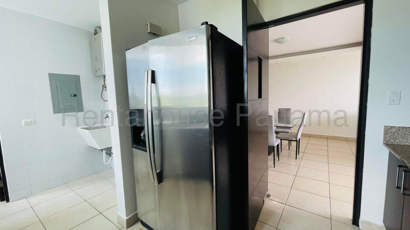 Kitchen in Clayton Park apartment with granite countertops, stove and cabinetry.