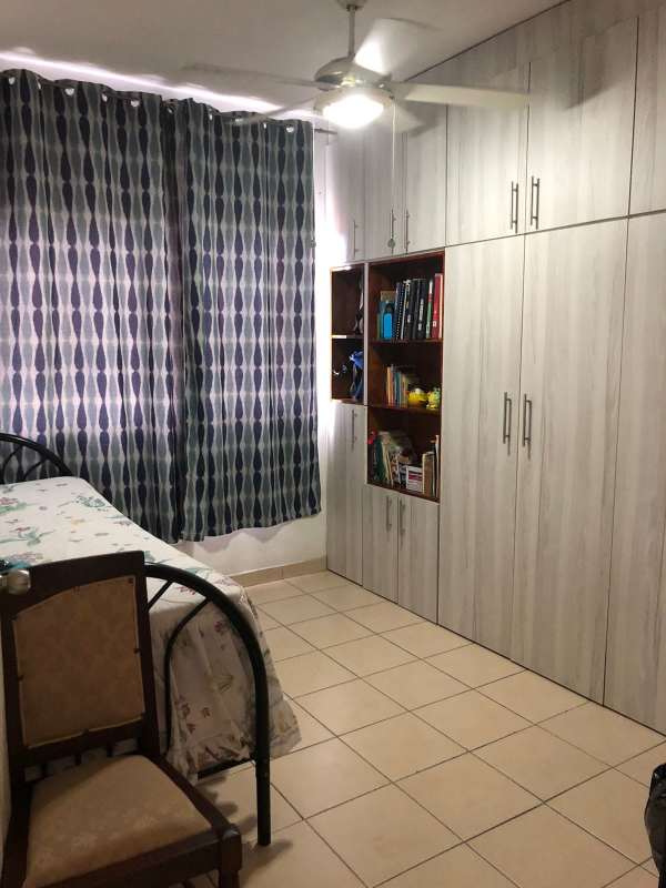 Bedroom with large wardrobe storage, ceiling fan, tile floors at PH Saramel Panama City