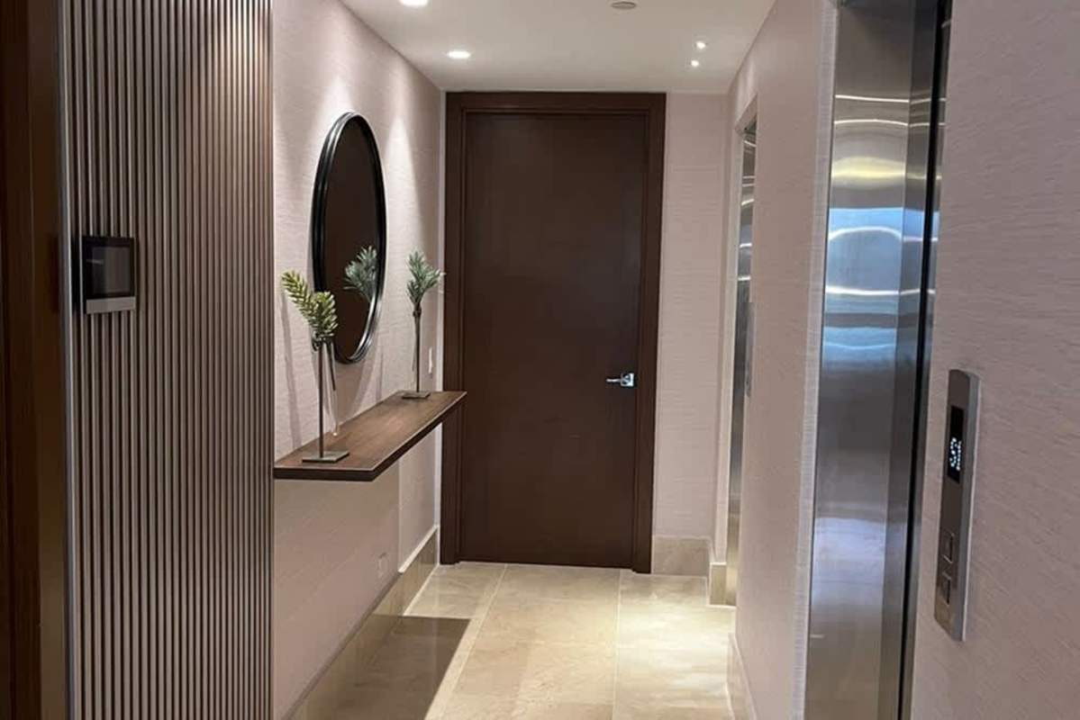 Modern bathroom featuring double sink vanity, mirrors and elegant finishes at The Reserve Panama