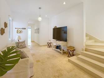 Elegant master bedroom with balcony overlooking lake in Buenaventura Panama