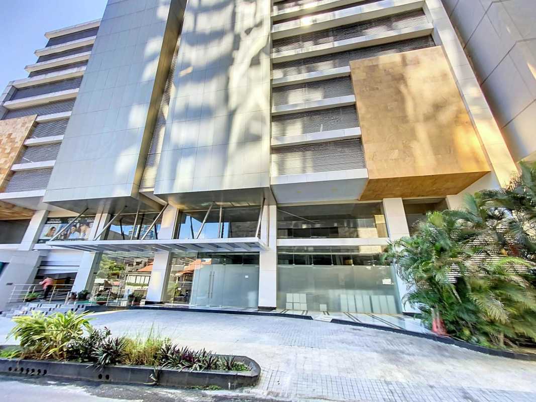Modern lobby entrance with marble and wood panels and security turnstiles PH Atrium Obarrio Panama
