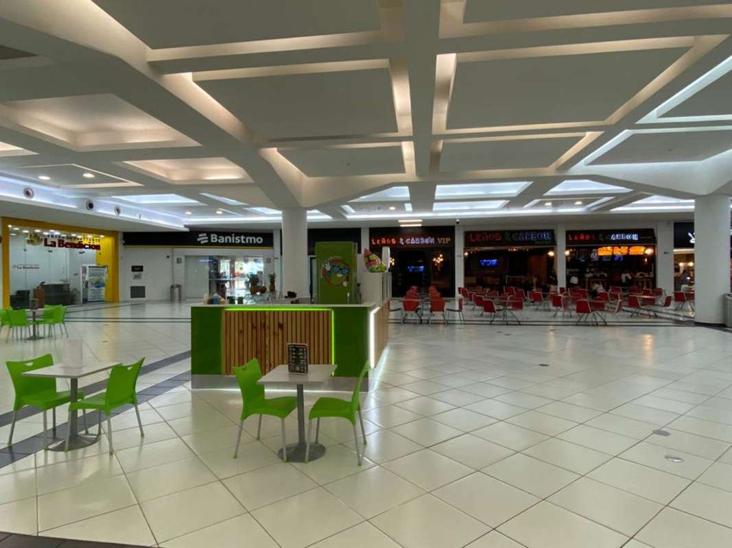 Exterior of Albrook Mall retail space with colorful facade and multiple signage Panama