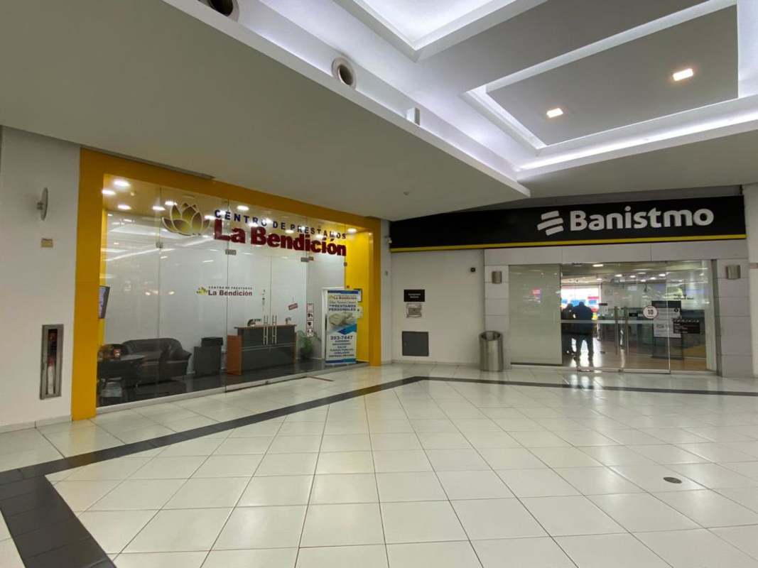 Shopping mall facade with service doors and delivery entrance at Albrook Mall Panama City