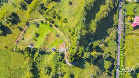 Hillside country scenery with pasture, fencing, and mountain views for sale in Volcán Panama