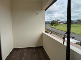 Tile-floored balcony with glass doors facing garden and mountain views Los Molinos Boquete