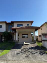 View of lake, road and greenery in gated Los Molinos Boquete residential community Panama