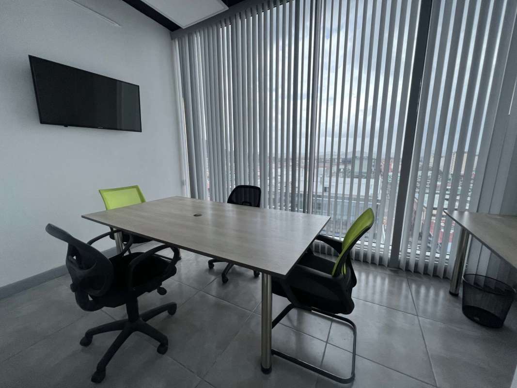 Bright conference room with panoramic windows and city-ocean views at PH BOC Avenida Balboa Panama