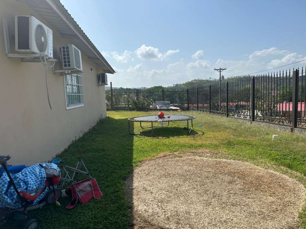 Fenced exterior wall of Praderas del Norte residence Tocumen Panama