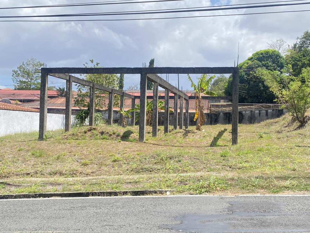 Residential street with open land lot greenery Las Cumbres Panama