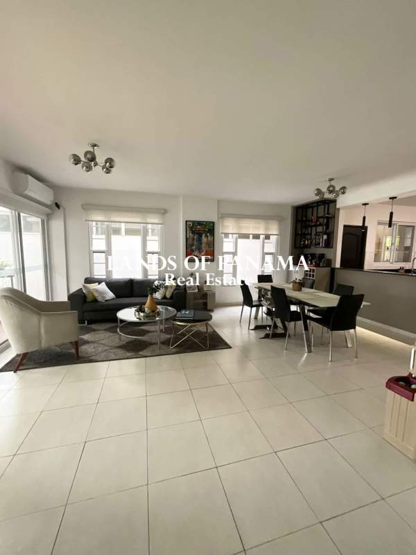 Entry foyer with decorative staircase and natural light Costa Sur villa
