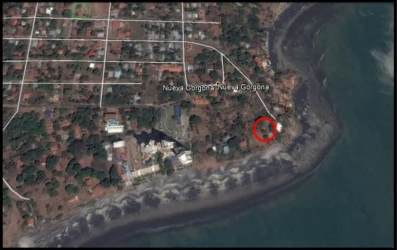 Aerial photo of coastal beachfront lot with nearby ocean and residential area Panama
