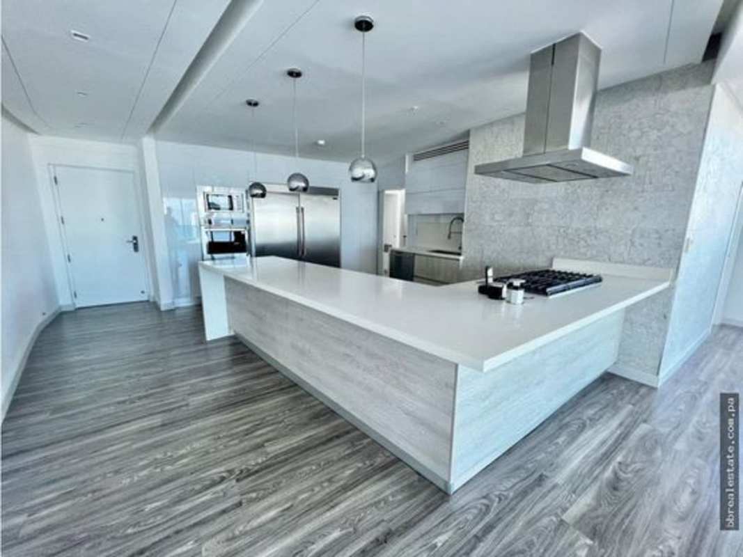 Modern bedroom with built-in closet, wood floors, neutral palette in PH Joy Tower Panama