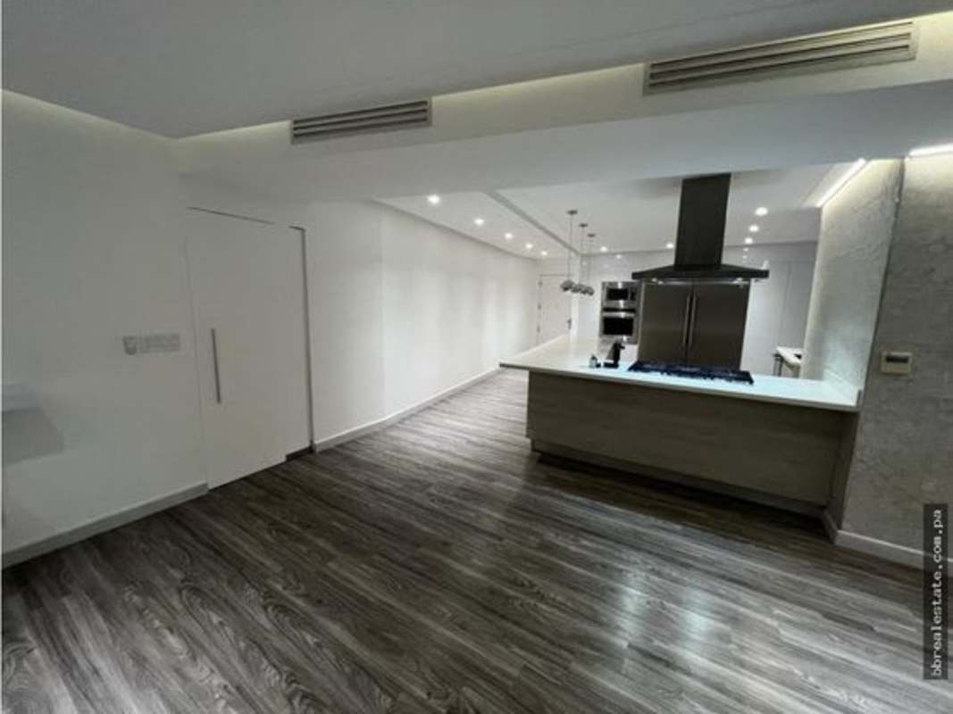 Spacious living room with city skyline and ocean view in PH Joy Tower Panama City