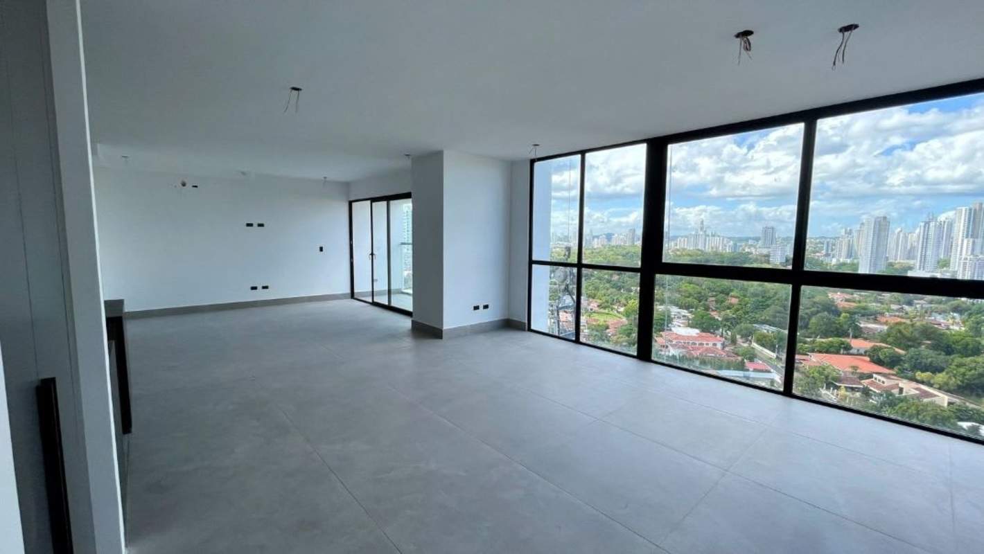 Minimalist bedroom with large windows city views in PH Victory Sport Tower Panama