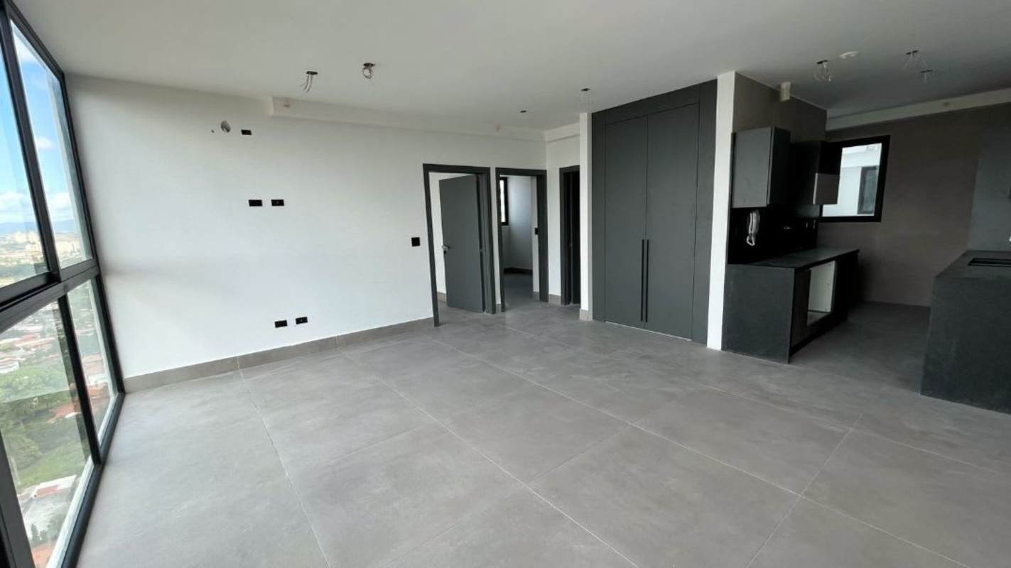 Contemporary open-plan living dining space with balcony access at PH Victory Sport Panama