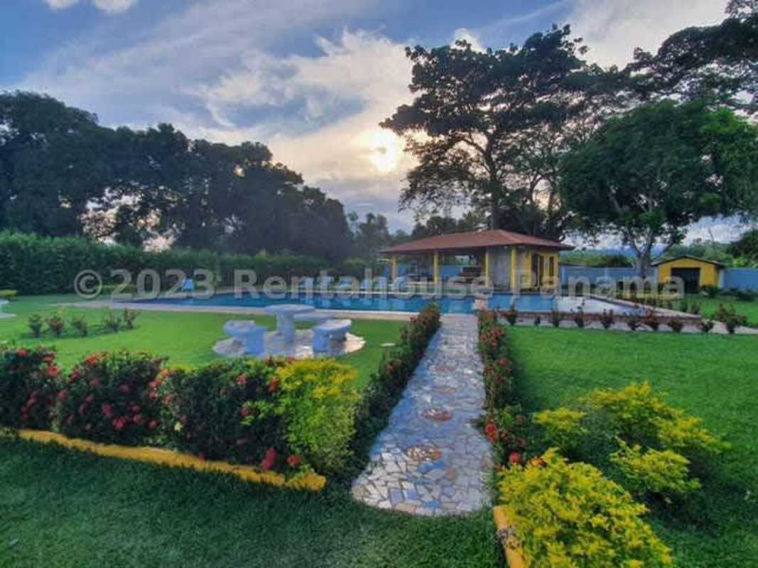 Wide paved streets and landscaped common spaces inside Villas del Llano Las Lajas Panama