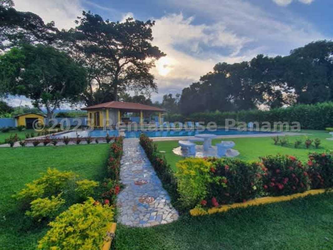Swimming pool, gazebo, and tropical landscaped gardens in PH Villas del Llano Panama