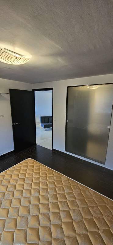 Modern bedroom with mattress, large window, AC and closet in Jardines de Costa del Este Panama City