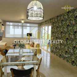 Master bedroom with large window and garden view in Coronado beach villa