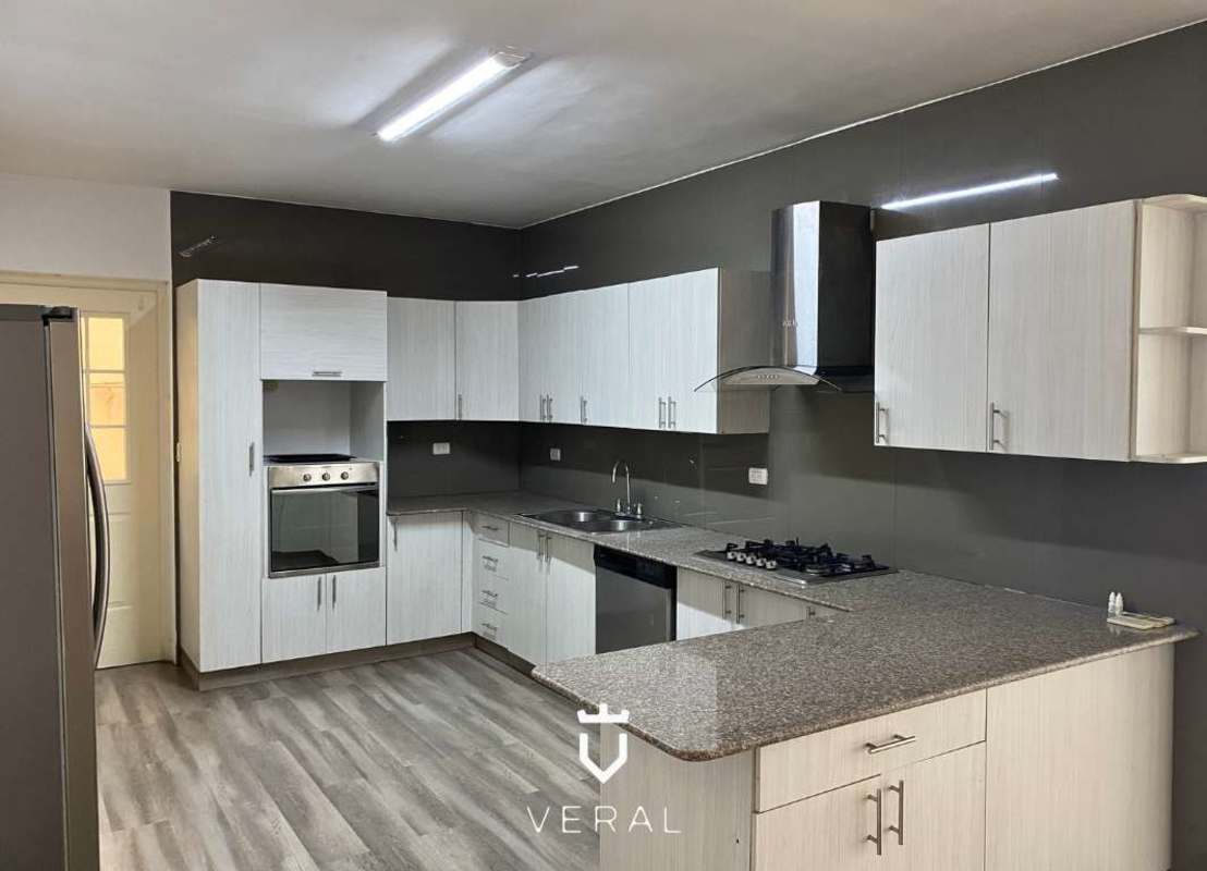 Large living and dining area with marble floors and natural light in luxury house Costa del Este Panama