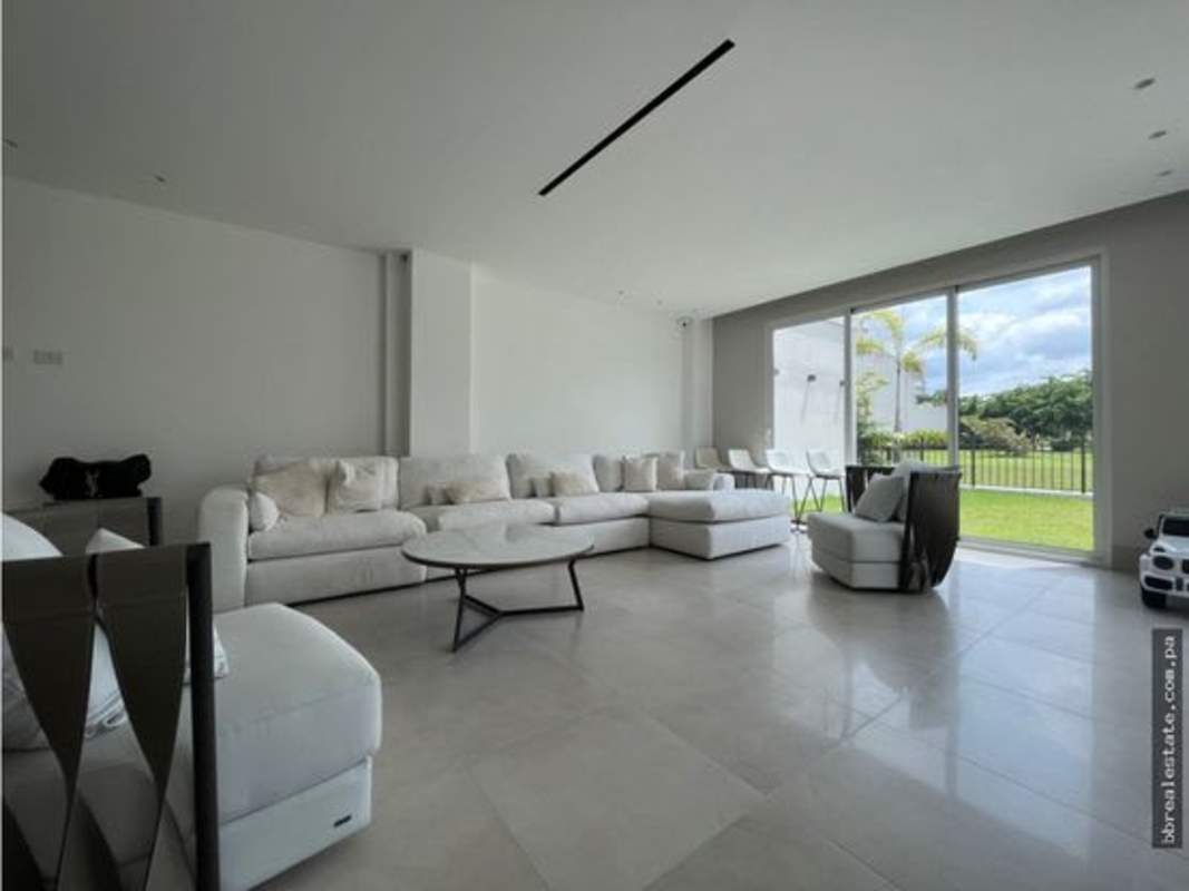 Modern kitchen with marble counters, glass backsplash, stainless appliances in Santa Maria luxury home Panama