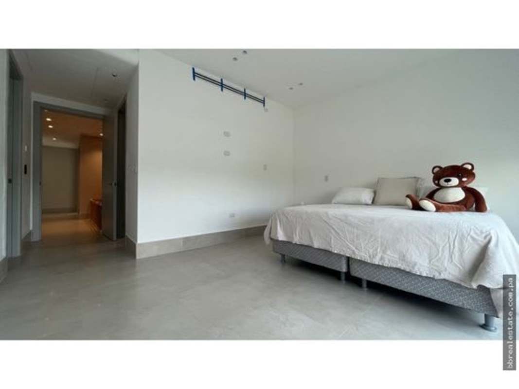Spacious bedroom with balcony and golf course view in Santa Maria townhome Panama