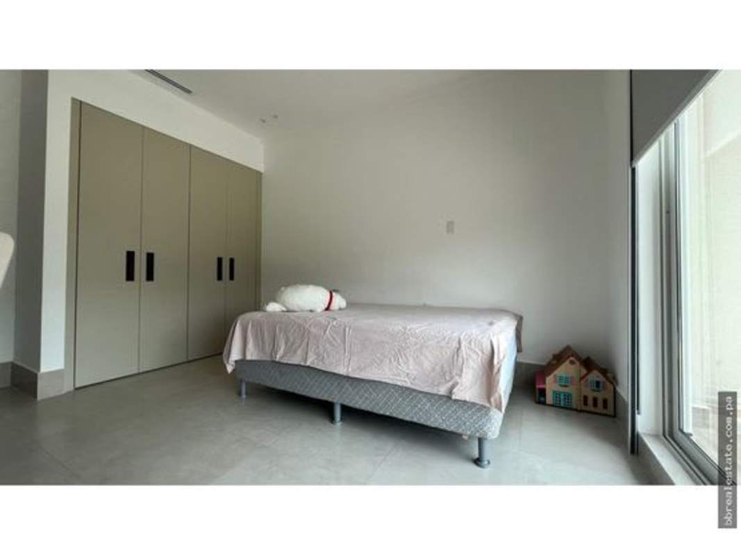 Elegant dining area featuring large windows and modern decor in luxury townhome Santa Maria Panama