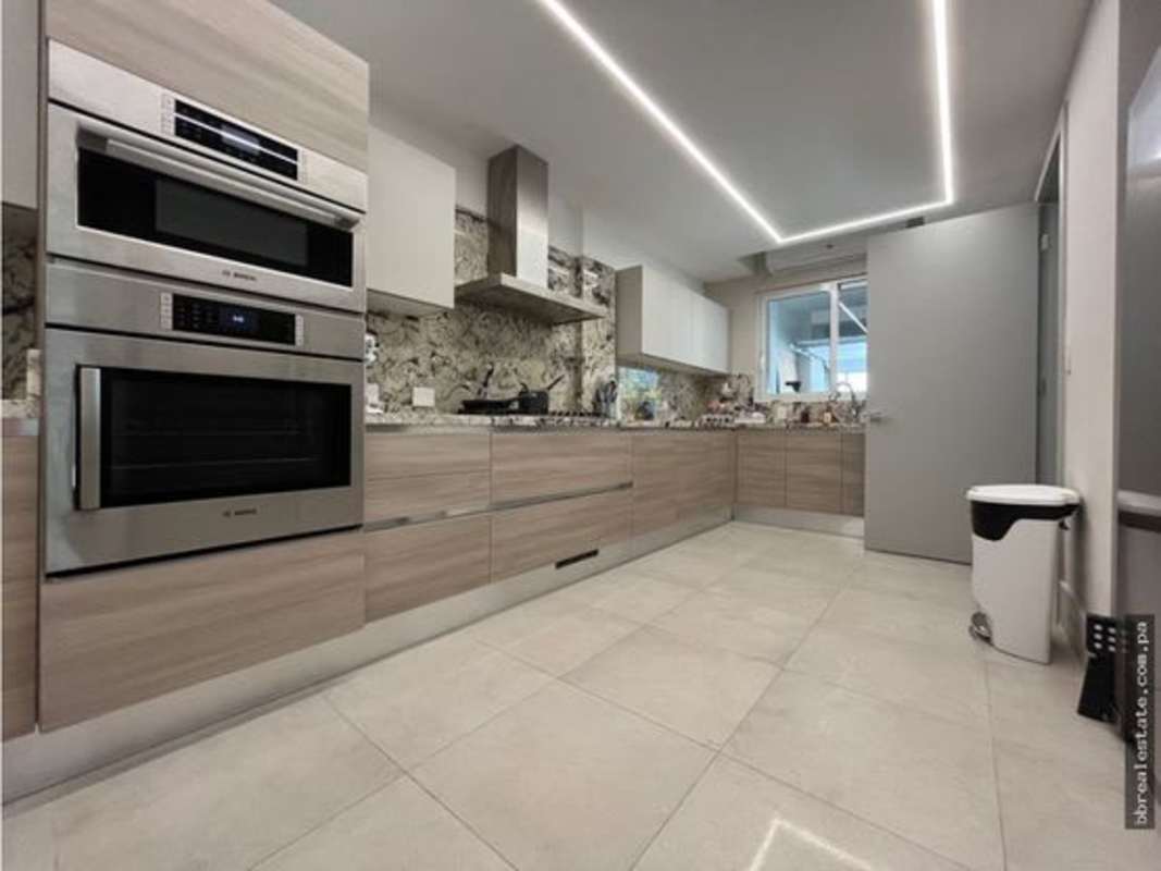 Master bathroom with double sink marble vanity and glass shower in Santa Maria townhome
