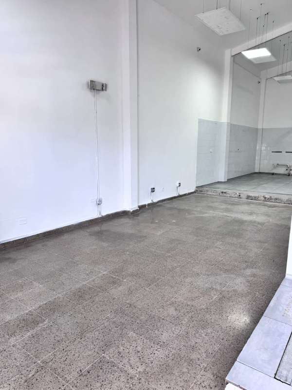 Empty commercial unit with tiled floors and partial wall partitions in Rio Abajo Panama City
