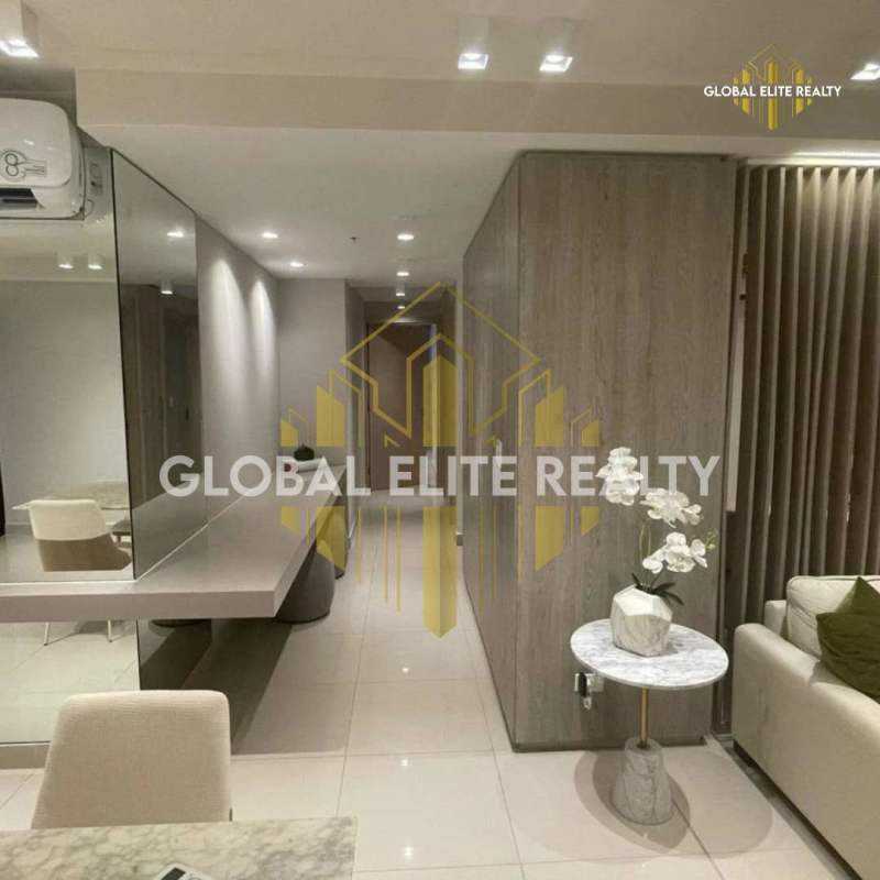 Contemporary kitchen with minimalist cabinetry light counters in PH Balboa Bay Avenida Balboa Panama City