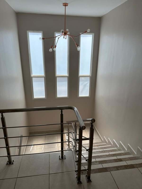 Comfortable bedroom with air conditioning, curtains, and natural light house rental PH Brisas del Golf Panama