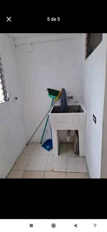 Simple kitchen with blue tiled counter and louvered window PH La Colina Condado del Rey