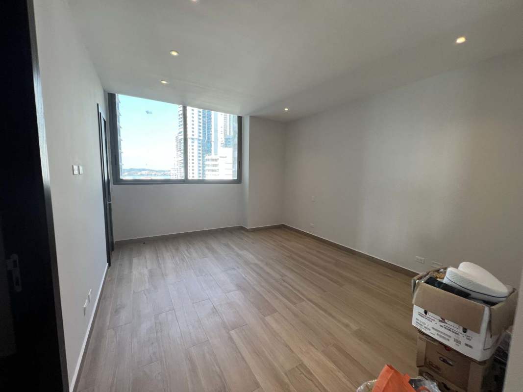 Modern bathroom with marble counter and walk-in glass shower in new apartment PH Sea Point Punta Paitilla