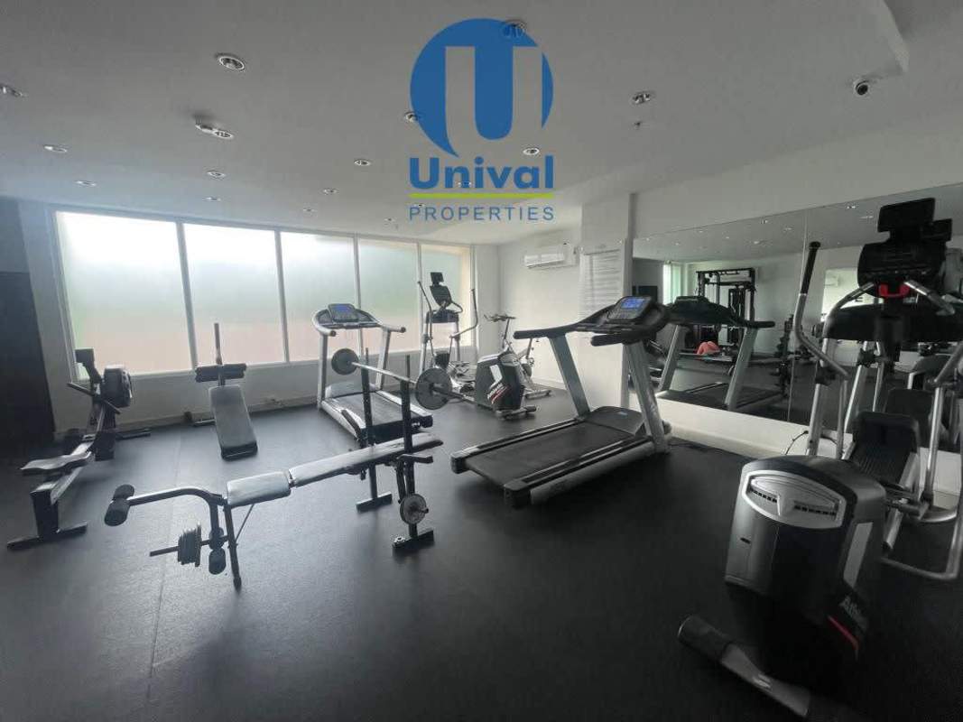 Furnished living area with balcony view in Condado del Rey Panama rental apartment