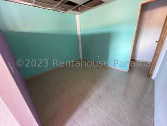 Empty bedroom with mint green walls and tiled floor in Nuevo Chorrillo Panama