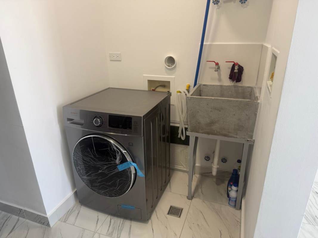Dining space leading to balcony with skyline views PH El Botánico Bella Vista Panama