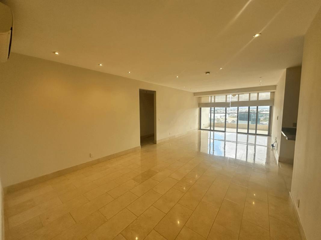 Contemporary kitchen with white cabinetry, stainless appliances, and marble floor
