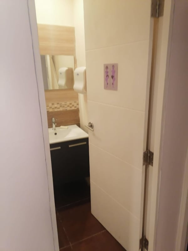 Modern bathroom with elegant tiles and sink inside premium office in PH BICSA Tower Panama City