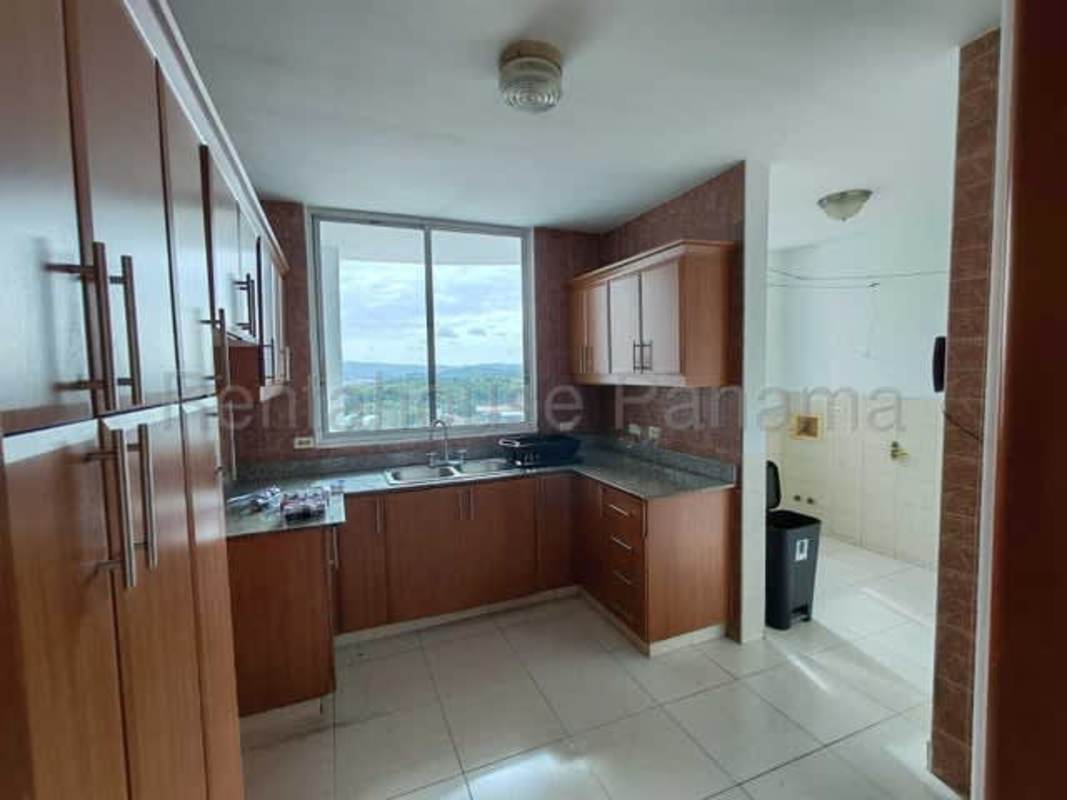 Bathroom with glass walk-in shower, granite sink, and large mirror in PH Mont Royale El Cangrejo Panama City