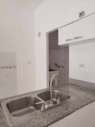 Kitchen with granite counters and white cabinetry PH Villa Dorada Nuevo Emperador Panama