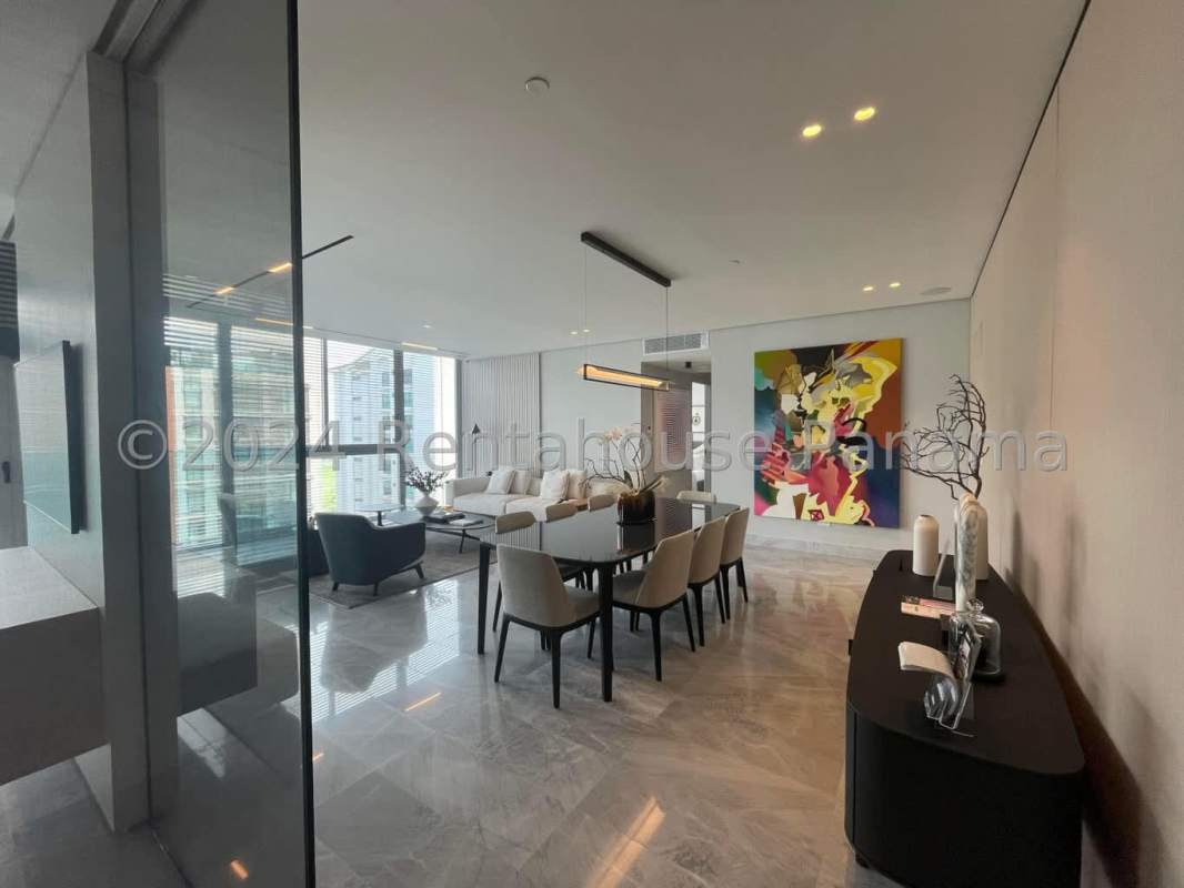 Spacious living room with floor-to-ceiling windows, marble floors, panoramic golf and city views at The Ivy Santa María Panama