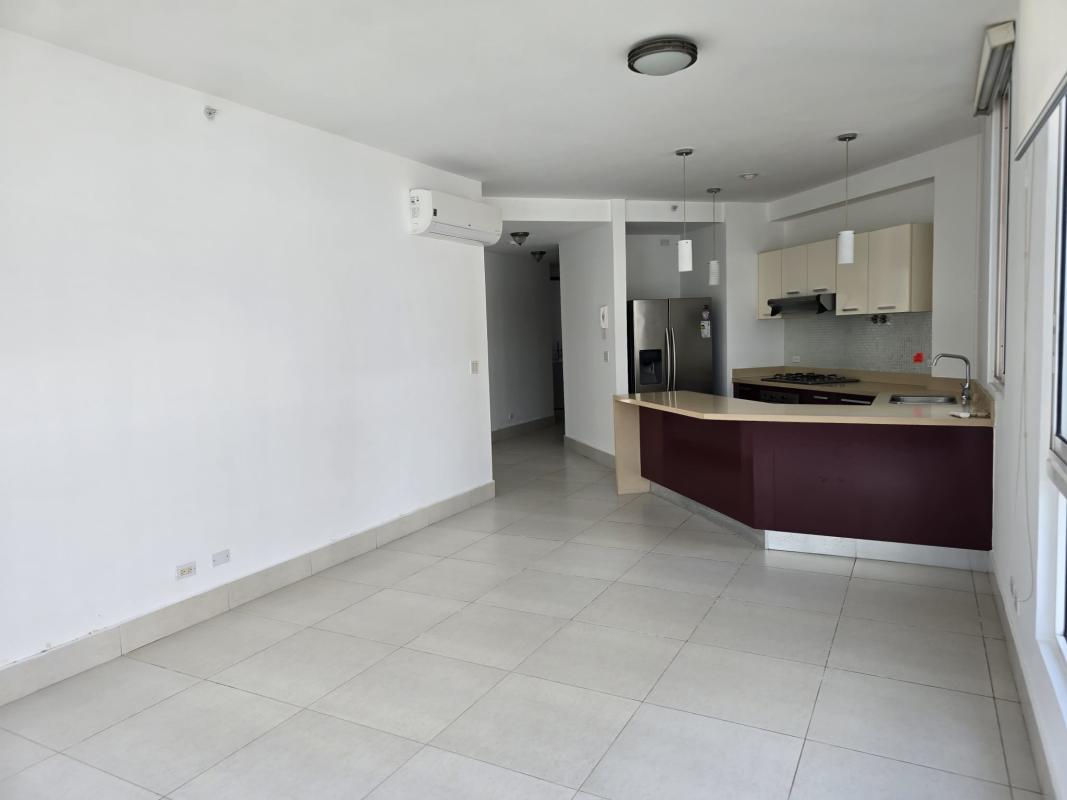 Bedroom with large window and city view in PH Castellammare Costa del Este Panama