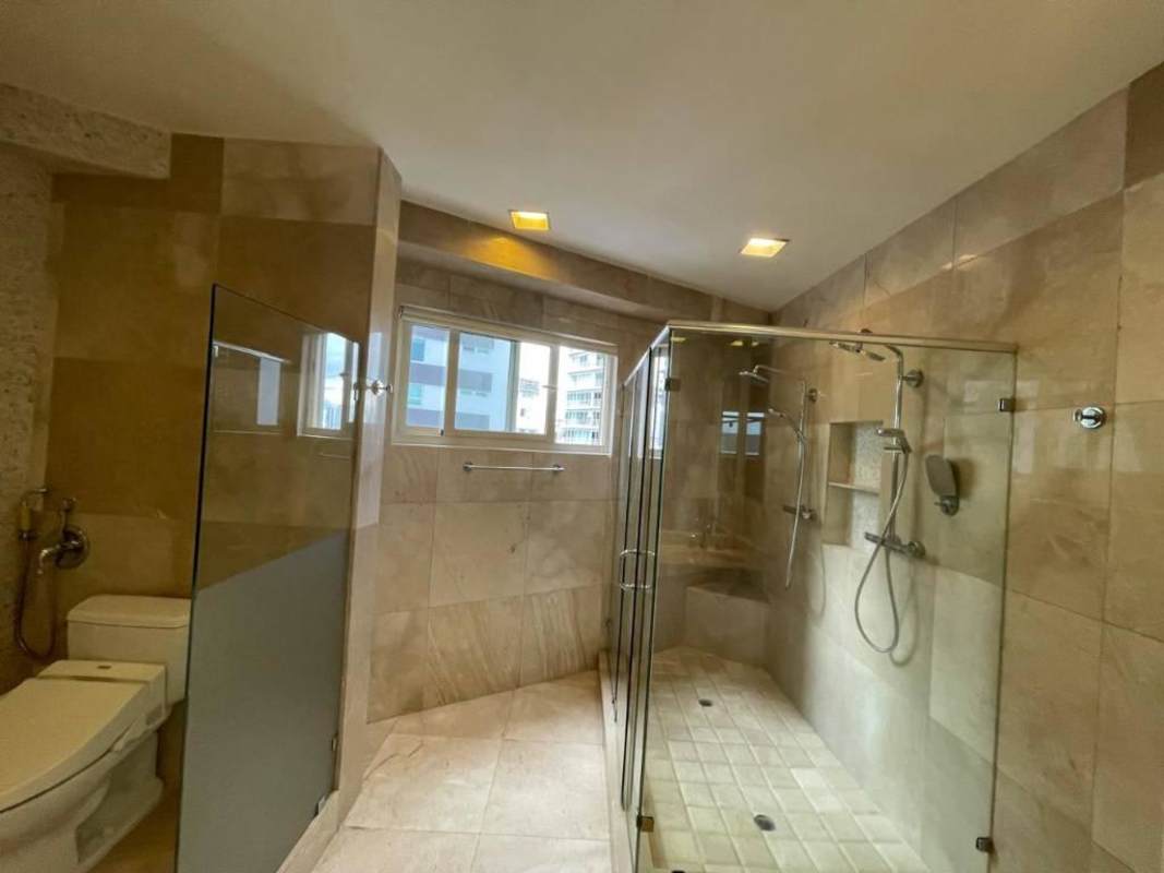 Spacious modern bathroom with glass enclosed shower and city view PH D1 Panama