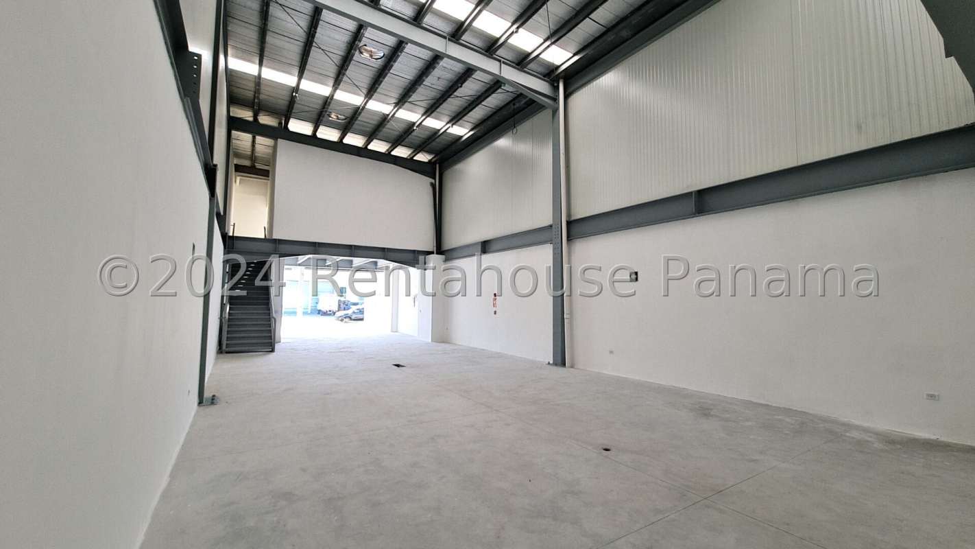 Entrance driveway with modern commercial building facade in industrial park Panama