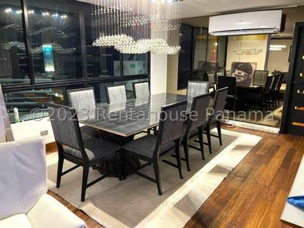 Main bedroom with balcony access, built-in closet, AC, wood floors and city-ocean views in Punta Paitilla