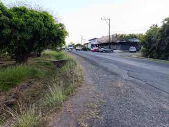Corner view of large commercial lot with fencing and street access in Canto del Llano Santiago Panama