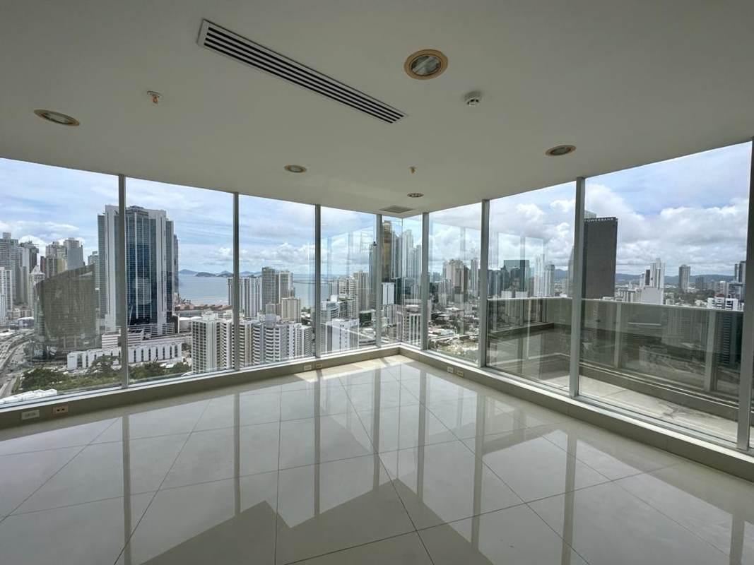 Modern empty luxury office with panoramic skyline view from floor-to-ceiling windows in F&F Tower