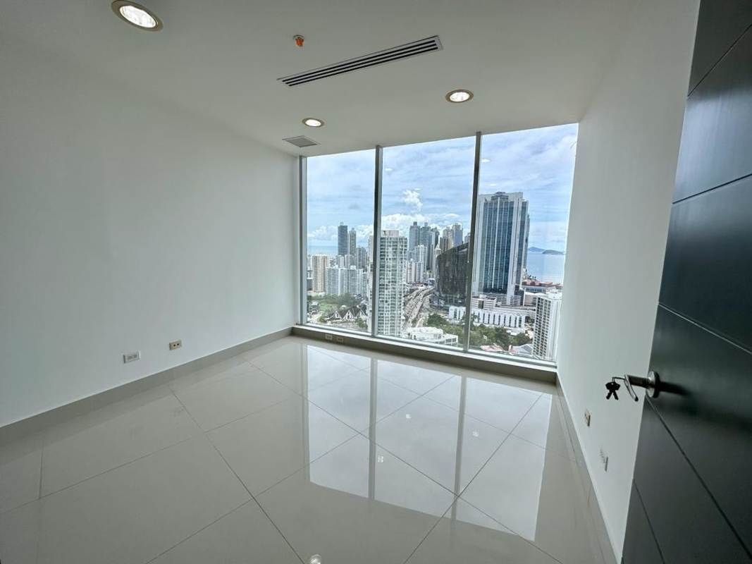 Empty modern panoramic office in F&F Tower with ocean and skyline views floor-to-ceiling windows